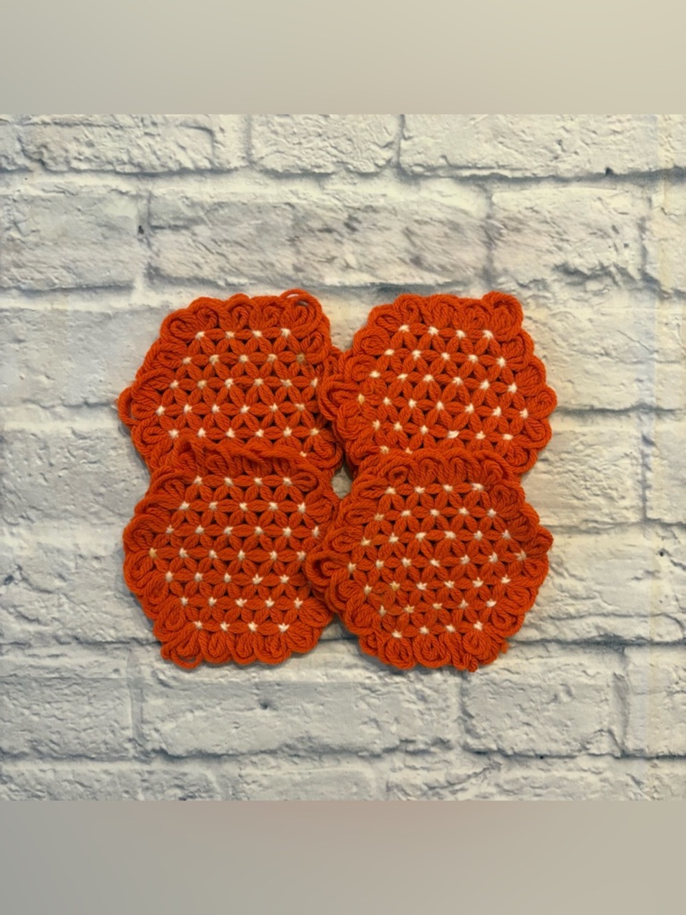 Vintage hand-knit orange floral-stitched coasters (4 count)